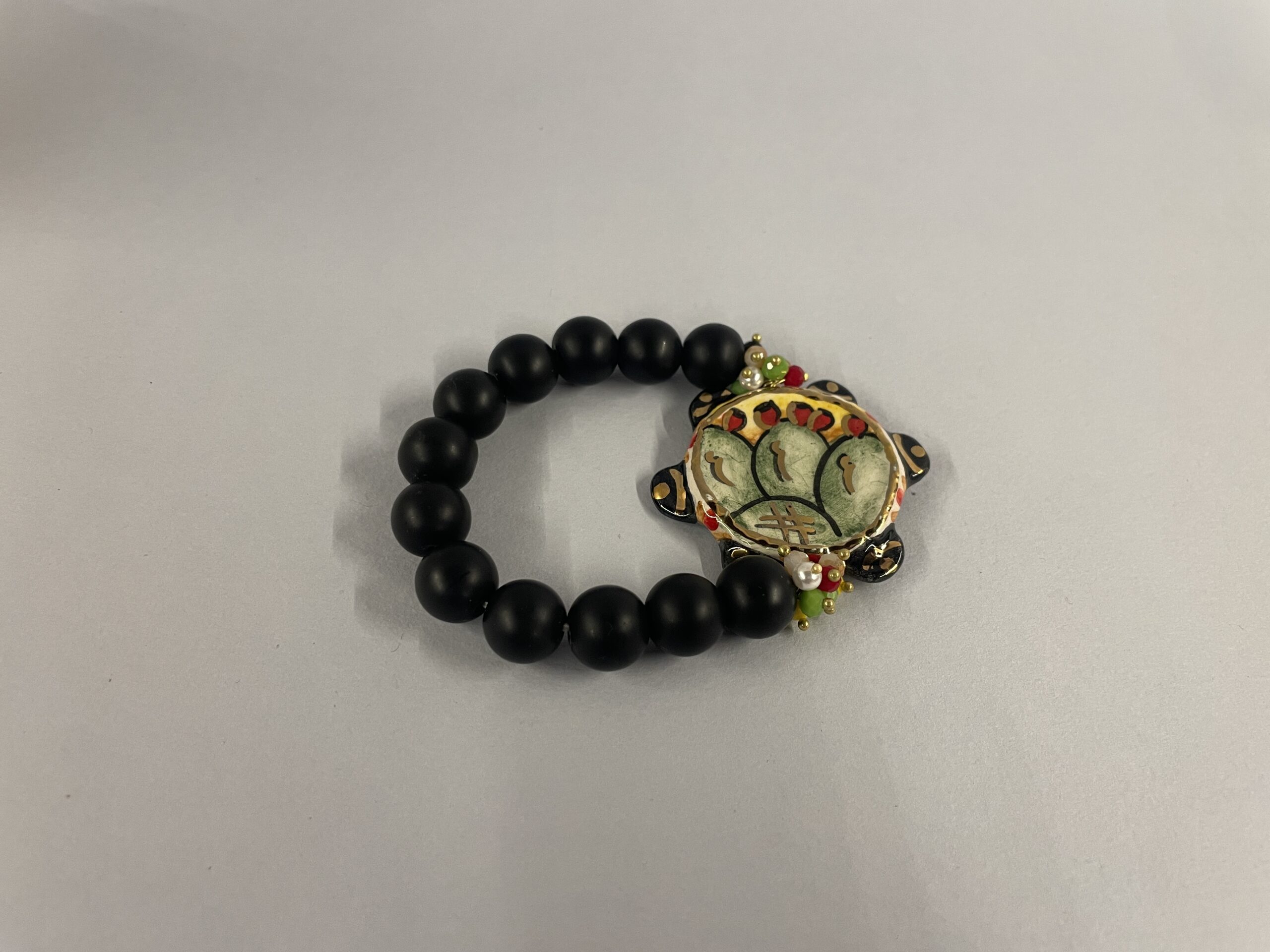 bracciale artigianale siciliano con lava e tamburello