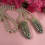 collana lunga perle rosate e corno