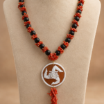 collana lava, corallo e Trinacria